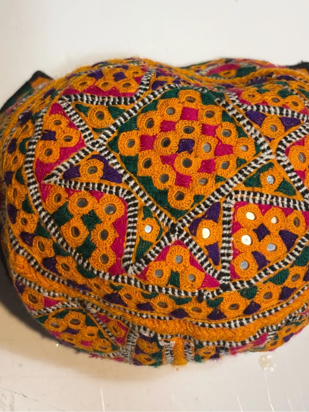 traditional handmade Balochi or Bugti cap featuring vibrant yellow embroidery
